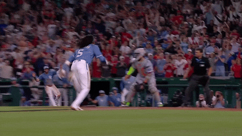 CJ Abrams sliding into home plate, called safe by the umpire